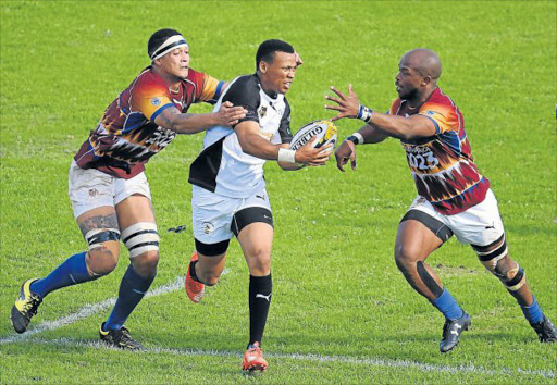 CLOSE ENCOUNTER: Old Boys outside centre Lonwabo Ntleki tries to break through the Tygerberg defence as Keegan May, left, and Minenhle Mthethwa close him down during their Gold Cup match at Mike Pendock Motors Park on Saturday Picture: SINO MAJANGAZA