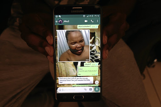 Ntokozo Ntshangase shows a photo of his pregnant girlfriend, Mbali Mvungande. /SANDILE NDLOVU