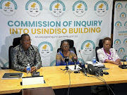 Gauteng premier Panyaza Lesufi and justice Sisi Khampepe during the official handover of the first part of a report from the Usindiso building commission of inquiry in Midrand. 