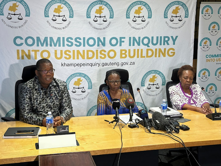 Gauteng premier Panyaza Lesufi and justice Sisi Khampepe during the official handover of the first part of a report from the Usindiso building commission of inquiry in Midrand.