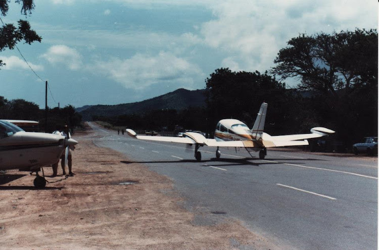 "Well, since we can't drive home we'll have to fly. Light aircraft about to take off on the N2." Picture: PETER HUGHES