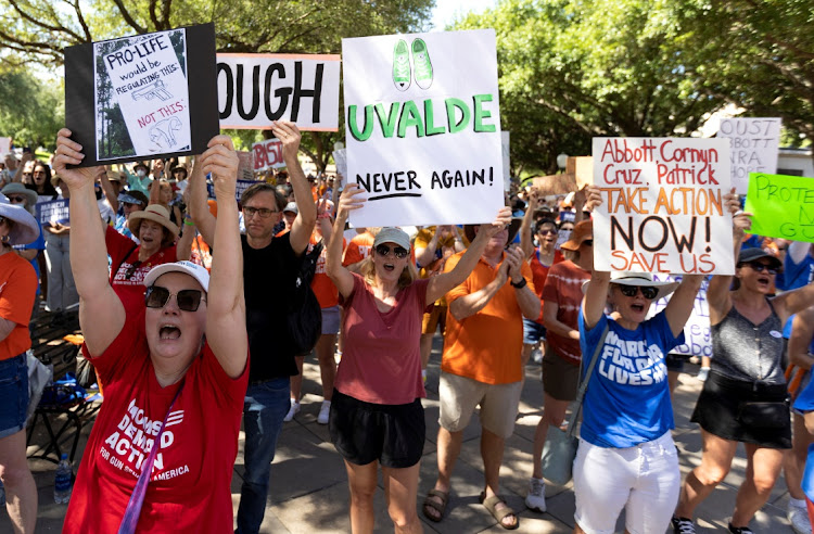 Rhonda McMahon of Austin, Texas, left, cheers on speakers during a "March for Our Lives" rally, one of a series of nationwide protests against gun violence, in Austin, Texas, US on June 11, 2022.