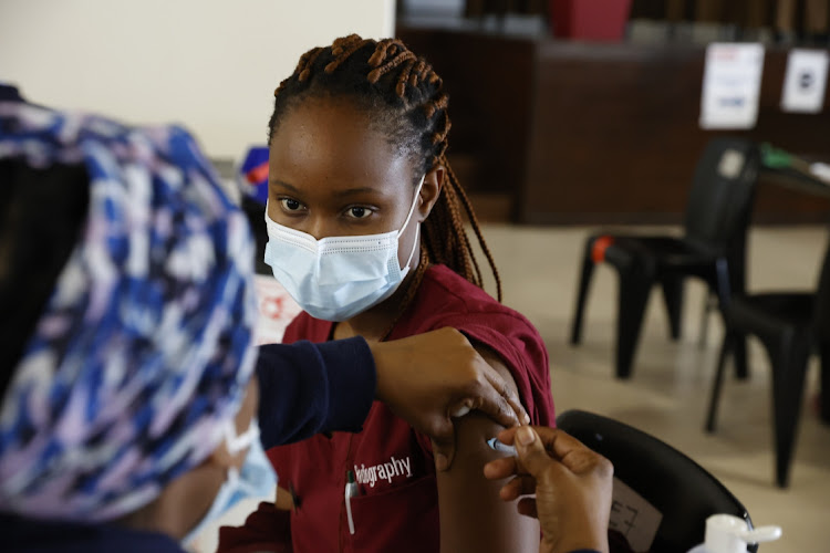 Nozipho Mbatha a student radiographer at the University Johannesburg gets a Johnson & Johnson vaccine booster shot at the Charlotte Maxeke Johannesburg Hospital.