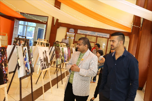 Hindu Council of Kenya chairman Nitin Malde with Jiten Sumaria admiring the exhibition.