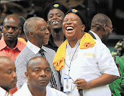 OUT OF THE MAIN SPOTLIGHT: Former president Thabo Mbeki and ANC Youth League president Julius Malema have a good laugh during the ANC's centenary celebrations at Mangaung in Bloemfontein yesterday Picture: SIMPHIWE NKWALI