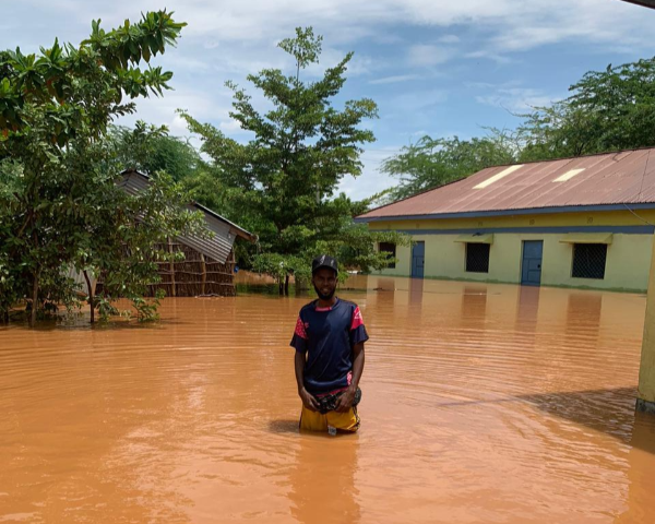 A man walks in flood waters in Bula Punda, Galbet ward in Garissa on April 29, 2024