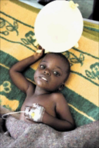 HELPLESS: A baby suffering from cholera in Zimbabwe, where more than 2000 victims have reportedly died from the disease. 16/01./2009. Pic. Tsvangirayi Mukwazhi. © AP.