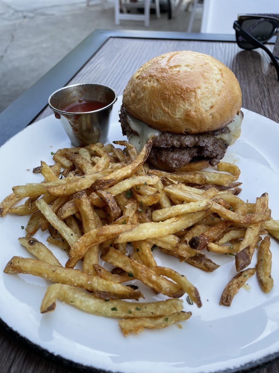 Burger with munster cheese, pickels and fries