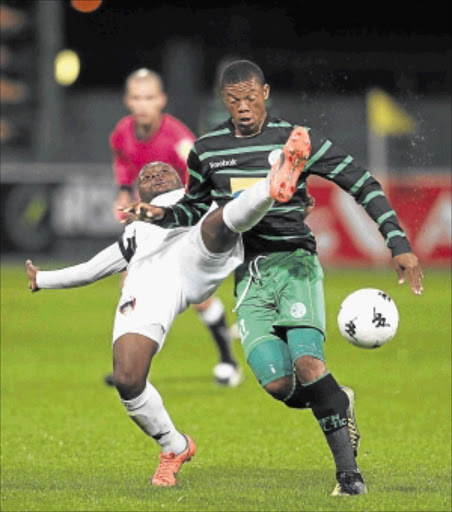 LEG UP: Bloemfontein Celtic striker Siyabonga Nontshinga, left, is challenged by Chippa United FC's Petrus Ngebo during their Premiership matchPhoto: Gallo Images