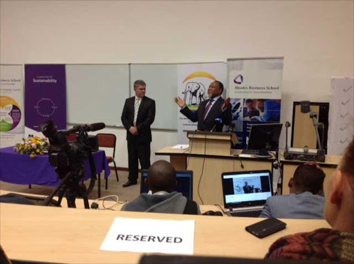 The power is in your hands: Former state president Kgalema Mothlanthe addresses a large crowd at the second annual Archbishop Thabo Makgoba development trust lecture at Rhodes University while business school director Professor Owen Skae looks on Picture: David Macgregor