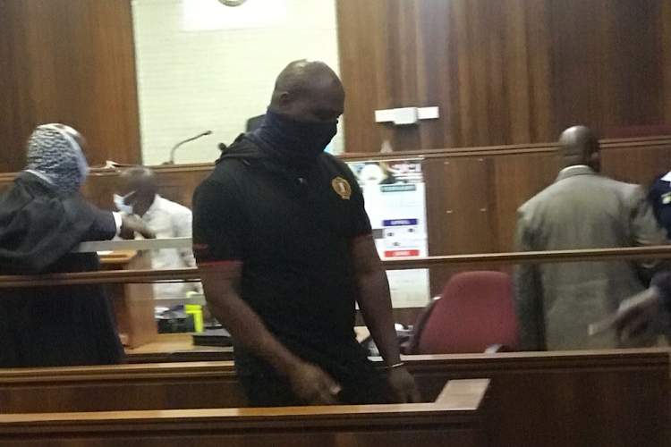 Josias Lekgoathe, 45, leaves the dock of the Kempton Park magistrate's court on Friday after he was denied bail for allegedly stealing R4.5m from his employer.