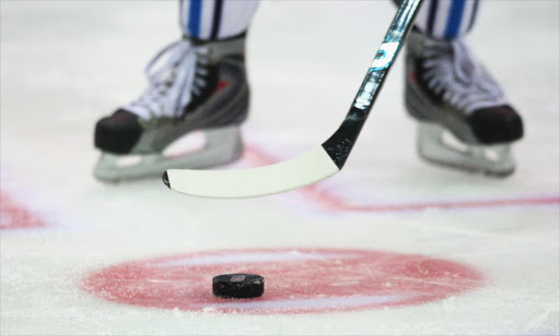 An ice hockey player addresses the puck during the IIHF World Championship match between Finland and Slovakia at the Arena Zurich-Kloten on May 1, 2009 in Zurich, Switzerland