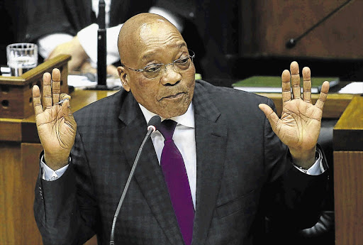 CLEAN HANDS: President Jacob Zuma answers questions from MPs in parliament yesterday