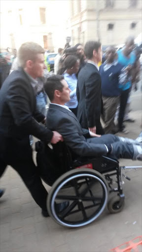 Carl Pistorius in a wheelchair following an accident. Picture: Tymon Smith filing live on Twitter for Times Media Group. https://twitter.com/OscarsTrial