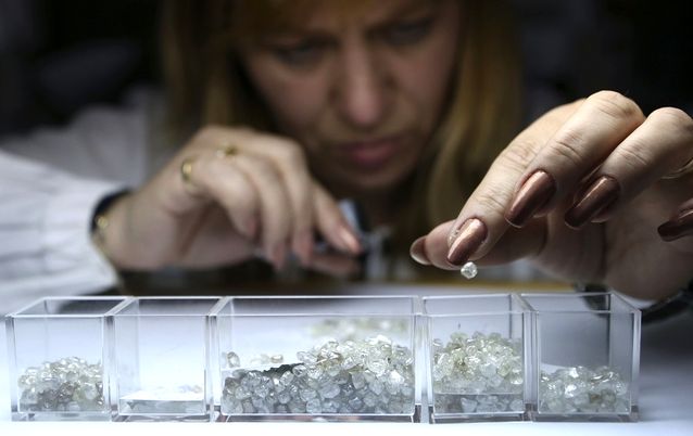 An employee sorts rough diamonds at a sorting centre in Moscow, Russia. File photo: REUTERS