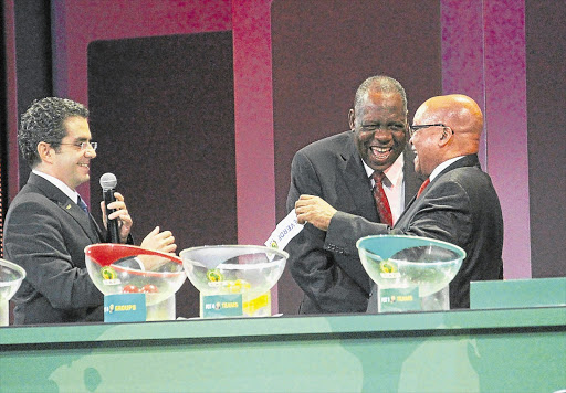 HAPPIER TIMES: Caf's Issa Hayatou shares a joke with President Jacob Zuma at the Afcon draw. This week he nodded off during Bafana's match against Angola in Durban Picture: GALLO IMAGES