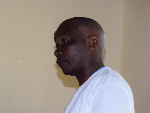 AP officer Jonah Kerich before a Kwale court where he was charged for unlawfully and intentionally defiling a 15 year old class eight pupil at Burani-Matuga in Kwale. /ALLOYS MUSYOKA