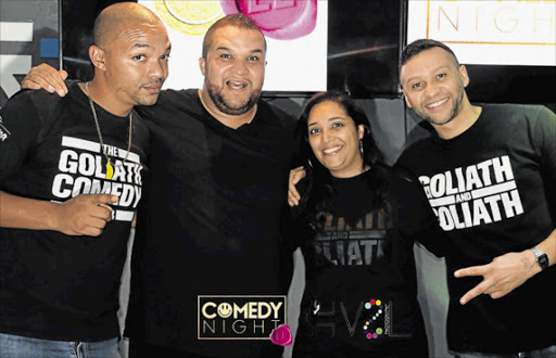GOOD HUMOUR: Comedy Night EC founder Sheree O'Brien, shares a moment with the legendary Goliath outfit. From left, Nicholas Goliath, Jason Goliath, O'Brien and Donovan Goliath Picture: SONGEZO LANGA