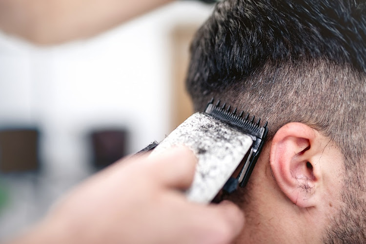 Generic image of a man getting a haircut.