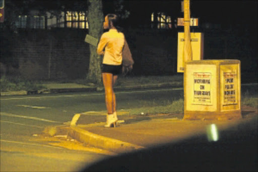 TRADING: A sex worker waits for business in Oxford Road, Rosebank, Johannesburg. Photo: Muntu Vilakazi