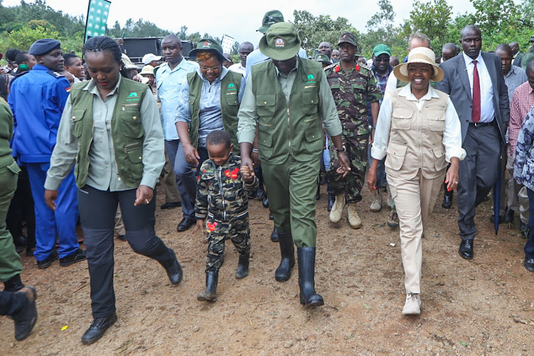 President William Ruto with Mama Rachel Ruto and Environment CS Soipan Tuya during the national tree planting day at Kiambicho Forest Karua Hill A, Murang'a County, on May 10, 2024.