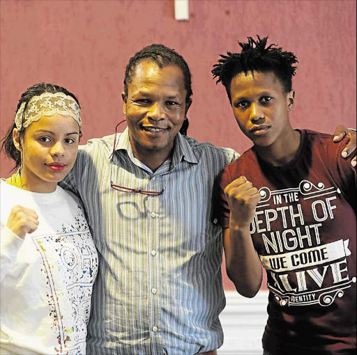 BIG THREE: Sharoddene Fortuin, right, pictured at yesterday’s weigh-in with her trainer Welcome Ncita and East London boxing sensation Leighandre Jegels Picture: MARK ANDREWS