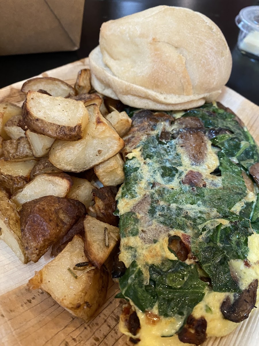 Build your omelette: bacon, spinach, mushroom, onion and cheddar cheese, with English muffin and rosemary potatoes