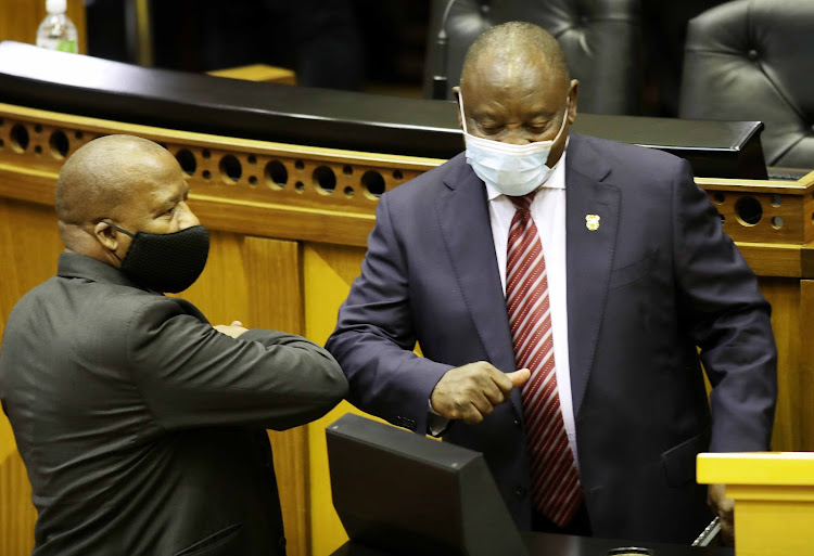 President Cyril Ramaphosa greets minister in the presidency Jackson Mthembu in parliament on Thursday, where the president presented the government's economic recovery plan.
