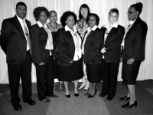 VANGUARD: Front row: Sanjeer Gareeb, Nomfundo Malinga, Nosipho Dlamini, Qinisile Mkhize, Theresa van Niekerk and Nonhlanhla Ngcobo are the consultants for the new call centre for teachers. Back row: Mbali Thusi, the education department communications manager, and KZN education MEC Ina Cronje. © Unknown.