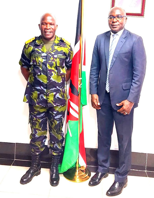 Major general Paul Otieno pose with KRA boss Humfrey Wattaga when he visited his office. /INTERNET