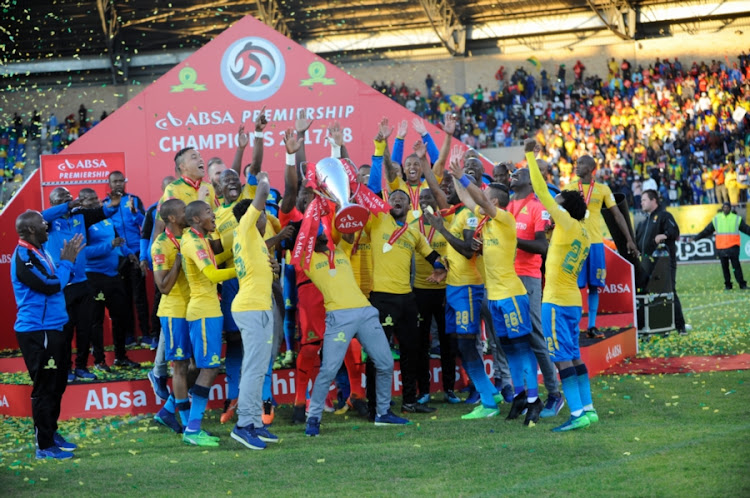 Mamelodi Sundowns coaching and playing stuff lift the Absa Premiership 2018/19 trophy after a goalless draw away at Bloemfontein Celtic on Saturday May 12 2018.