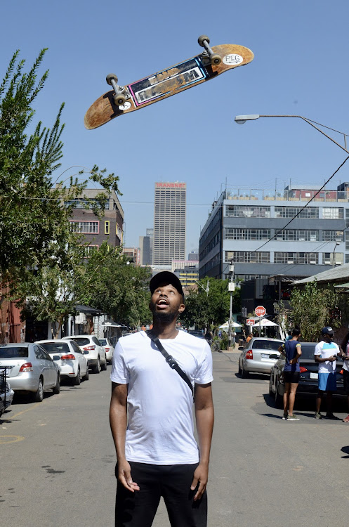 Ayanda Mnyandu, founder of City Skate Tours, and his board in the inner city.