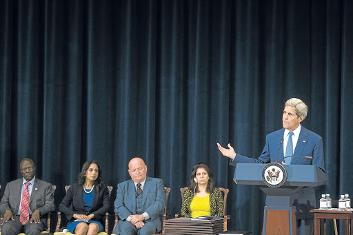 CONTROVERSIAL: US State Secretary John Kerry addresses an audience on his department’s 2015 trafficking report in Washington on Monday. On stage are award winners Moses Bingoa of Uganda, Parosha Chandran of Britain, Tony Maddox of the US and Ameena Saeed Hasan of Iraq Picture: EPA