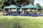 MAKING DO: 
       Galway Primary School, in Germiston, on the first of school. Children are seen attending classes in tents due to lack of classrooms. 
      PHOTO: BUSI MBATHA