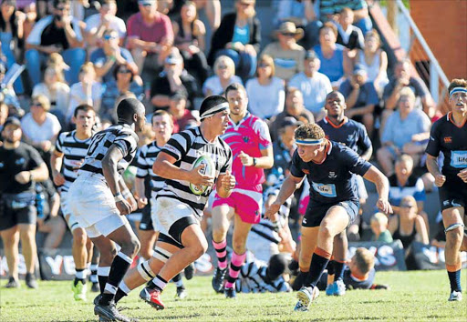 COMING THROUGH: Adam Mountford of Selborne with ball in hand, pushes forward with Sibabalwe Xamlashe in support during their home game against Bloemfontein’s Grey College on Saturday. Selborne won a close contest 20-19, their first win over Grey for 21 years Picture: MICHAEL PINYANA