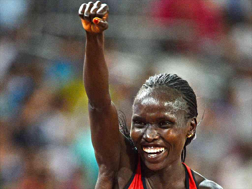 Vivian Cheruiyot celebrates after winning the women's 10000m final during the Beijing 2015 IAAF World Championships in Beijing, China, 24 August 2015. /REUTERS