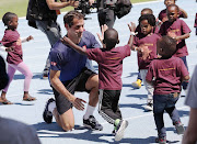 Roger Federer plays with children from Hangberg Pre-Primary School in Hout Bay at a 'learning through play' session at Green Point Athletics Stadium on February 7 2020.