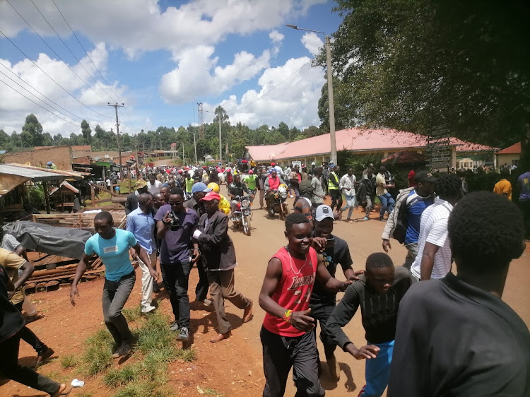 Residents of Nyamache in Bobasi scamper for safety after police disperse protests over delayed repair of a bridge, April 15, 2024.