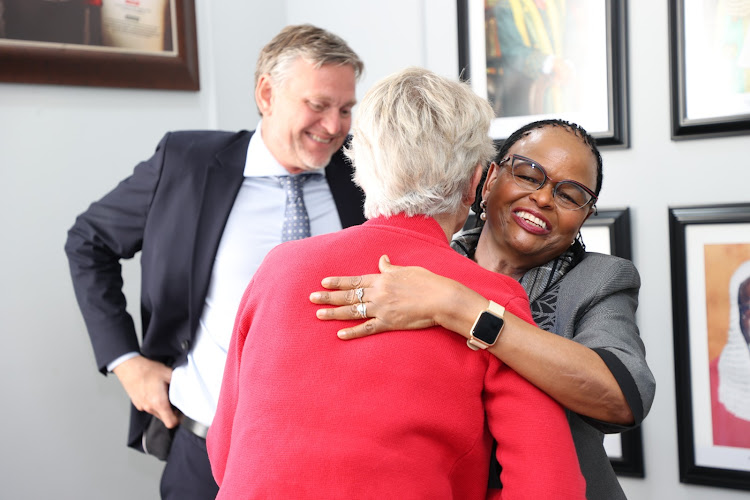 Chief Justice Martha Koome hugs the Ambassador of Sweden Caroline Caroline Vicini as Danish Ambassador to Kenya Ole Thonke watches on Monday, January 30,2023.