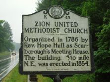 Organized in 1786 by Rev. Hope Hull as Scarborough's Meeting House. The building, 4/10 mile N.E., was erected in 1854.Plaque via North Carolina Highway Historical Marker Program, and is used with...