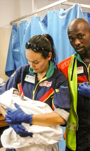 Netcare 911 paramedics Elmi Changuion and Walter Molife delivered baby 'Quantum' in a minibus taxi. The driver pulled over to the middle island on the M13 near Pinetown. Photos: Supplied