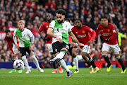 Mohamed Salah scores Liverpool's second goal from the penalty spot in their Premier League draw with Manchester United at Old Trafford on Sunday. 