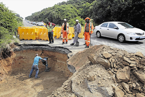 Road construction workers in a race against time to repair a large sinkhole that has caused traffic snarl-ups on the road between Umdloti and Umhlanga, two of KwaZulu-Natal's popular tourist destinations.