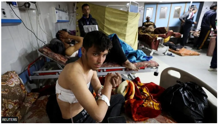 Palestinians wounded in the rush on the aid convoy resting at al-Shifa Hospital