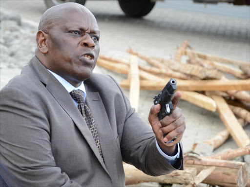 Former nominated Senator Paul Njoroge wielding a gun. /GEORGE MURAGE