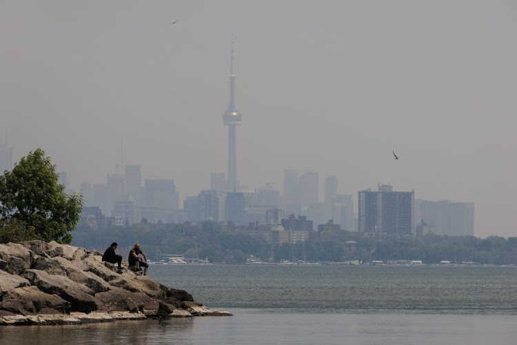 Smoke from wildfires in Toronto, Ontario, Canada, on Wednesday, June 7, 2023. Wildfires continue to burn large tracts of forest in Canada, with little sign weather will provide much help to firefighters who are battling the blazes that are sending smoke over major cities.