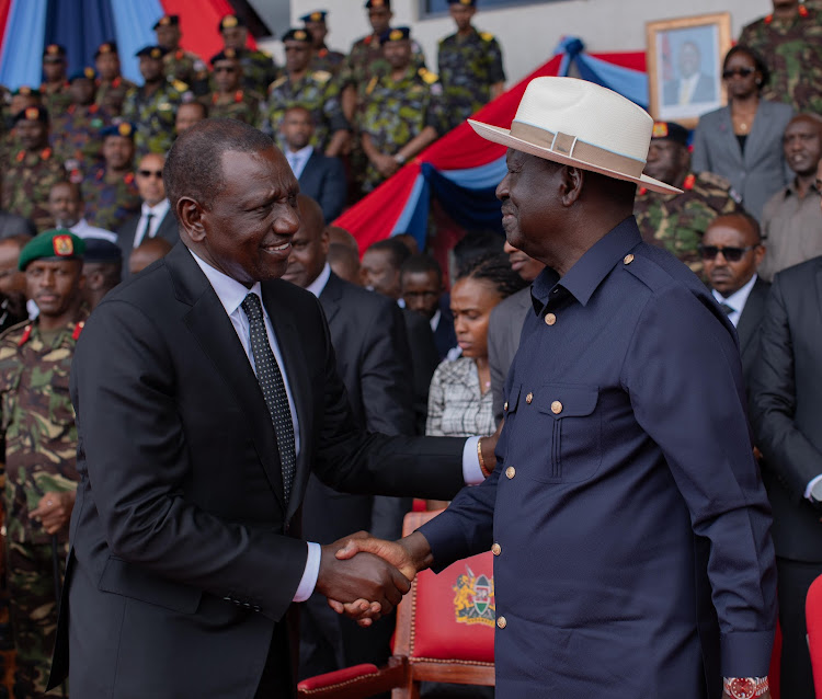 President William Ruto shakes hand with Opposition leader Raila Odinga during the memorial service of late General Francis Ogolla at Ulinzi sports complex on April 20, 2024.