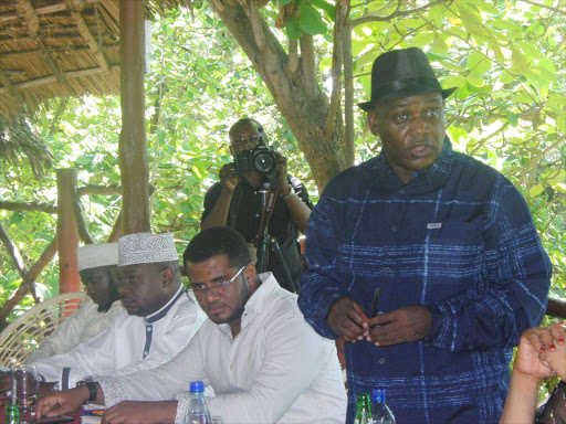 RIVAL BROTHERS: From right, Wiper treasurer Hezron Awiti, secretary general Hassan Omar and party members at Wild Waters Complex, Mombasa, on April 12 last year. Photo/Brian Otieno