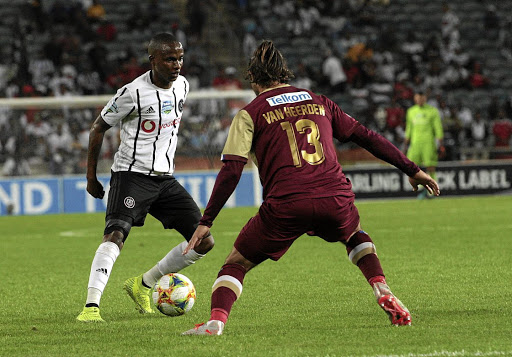 Thembinkosi Lorch of Orlando Pirates, left, tries to weave his way past Marc van Heerden of Stellenbosch during Saturday's Telkom Knockout first round, which Bucs won 1-0, thanks to Lorch's goal.