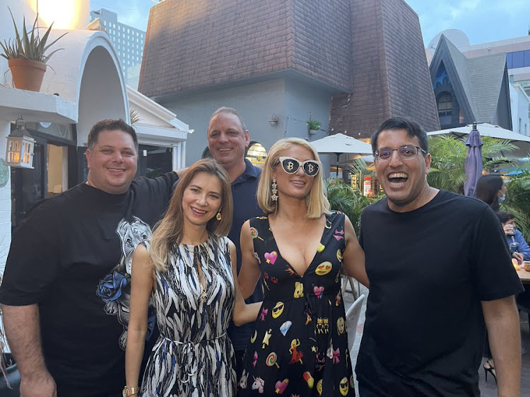 High-flying crypto developer Riccardo Spagni, left, poses with Paris Hilton and others in Miami, according to a tweet from TechCrunch founder Michael Arrington on June 6 2021.